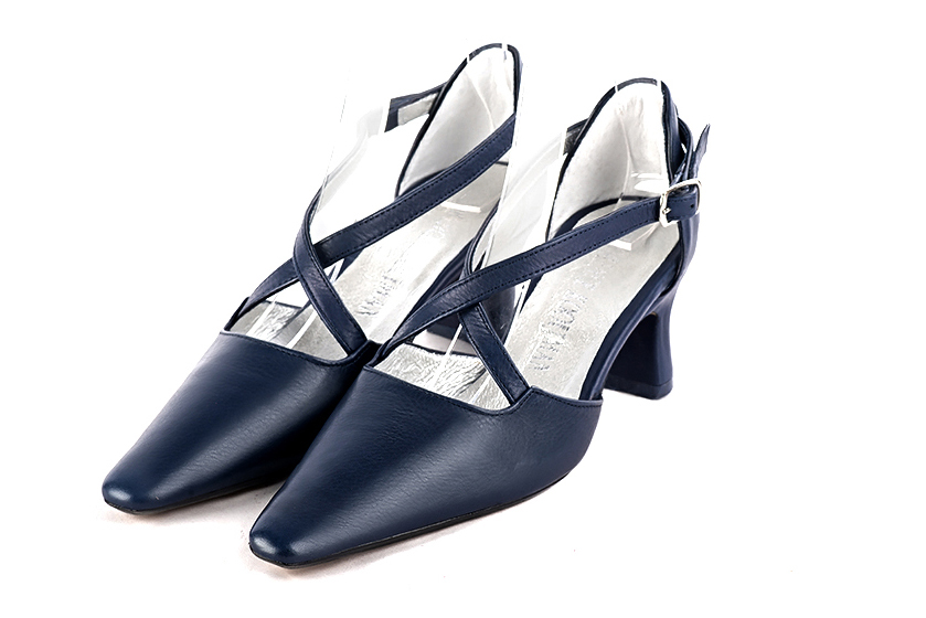 Navy blue open side elegant shoes, with crossed straps. Tapered toe. Medium spool heels.